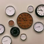white and brown analog wall clock at 10 00